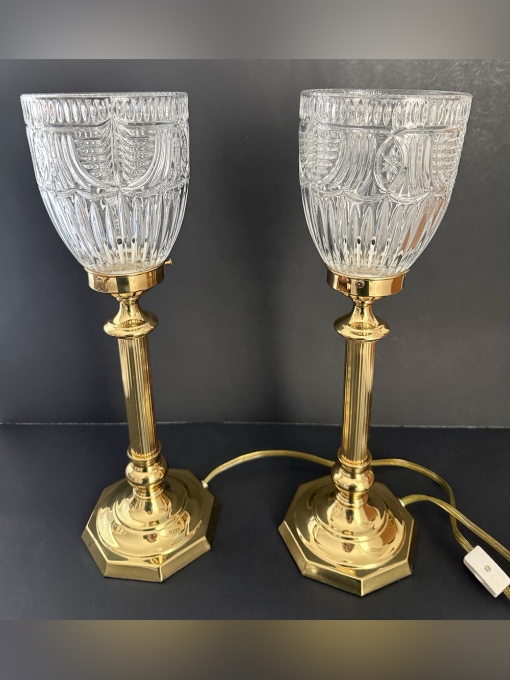 Two vintage torchiere hurricane lamps featuring crystal glass shades.